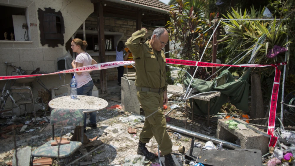 File Photo: Israeli home struck by a rocket fired from the Gaza Strip on the Israeli town of Yehud, on July 22, 2014, during Operation Protective Edge. Photo by Yonatan Sindel/Flash90