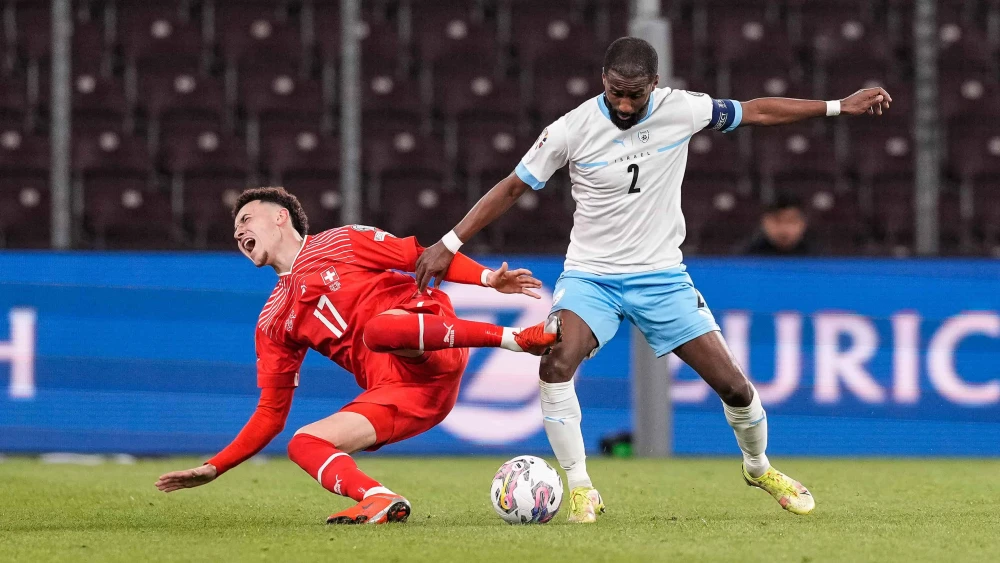 Rubén Vargas of Switzerland (left) against Eli Dasa of Israel during a UEFA EURO 2024 qualifying round group I match at Stade de Genève on March 28, 2023. Photo by Jari Pestelacci/Eurasia Sport Images via Getty Images.