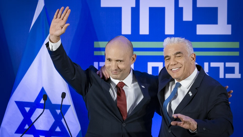 Yair Lapid and Naftali Bennett speak during a press conference announcing a joint list named “Together” ahead of upcoming elections, to be led by Bennett, in Herzliya, April 26, 2026. Photo by Chaim Goldberg/Flash90.