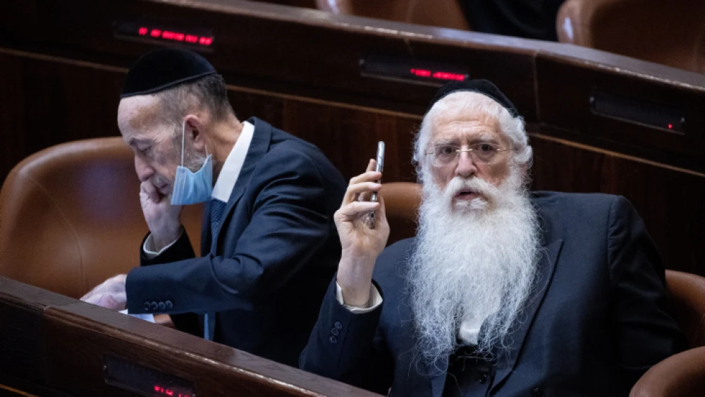 Knesset members Meir Porush (right) and Uri Maklev attend a plenary session at the Knesset, July 14, 2021. Photo by Yonatan Sindel/Flash90.