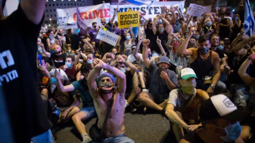 As the ongoing effects of the coronavirus and lockdowns have affected the economy, protesters block a road in Tel Aviv, calling for financial support from the Israeli government on July 11, 2020. Photo by Miriam Alster/Flash90.