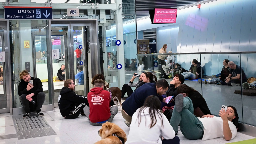 People take cover from incoming missiles fired from Iran at an undergoing train station in Tel Aviv, Feb. 28. 2026. Photo by Avshalom Sassoni/Flash90.