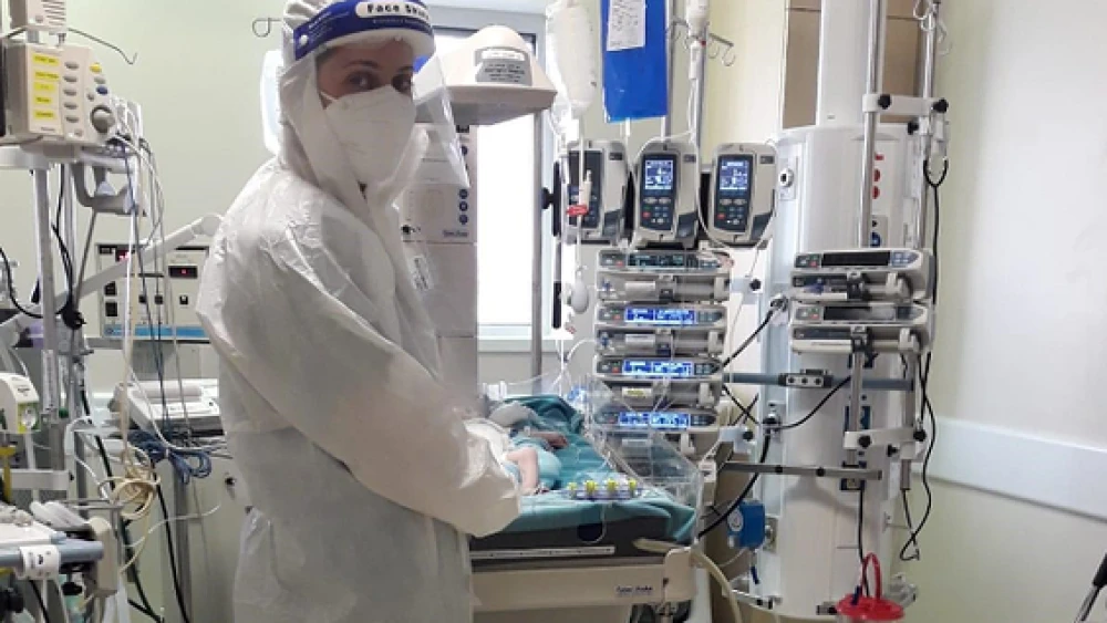 A nurse cares for a baby at Hadassah Medical Center-Ein Kerem's new pediatric COVID-19 ICU. Credit: Hadassah Medical Center.