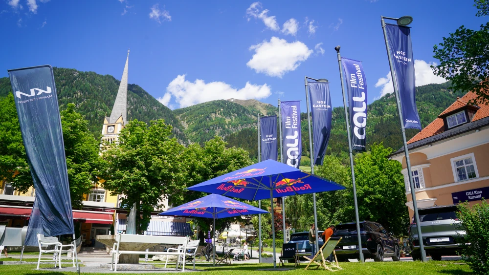 Banners wave in the wind during a cultural festival's opening in Bad Hofgastein, Austria on May 28, 2026. Photo by Julia Beverly/Getty Images.