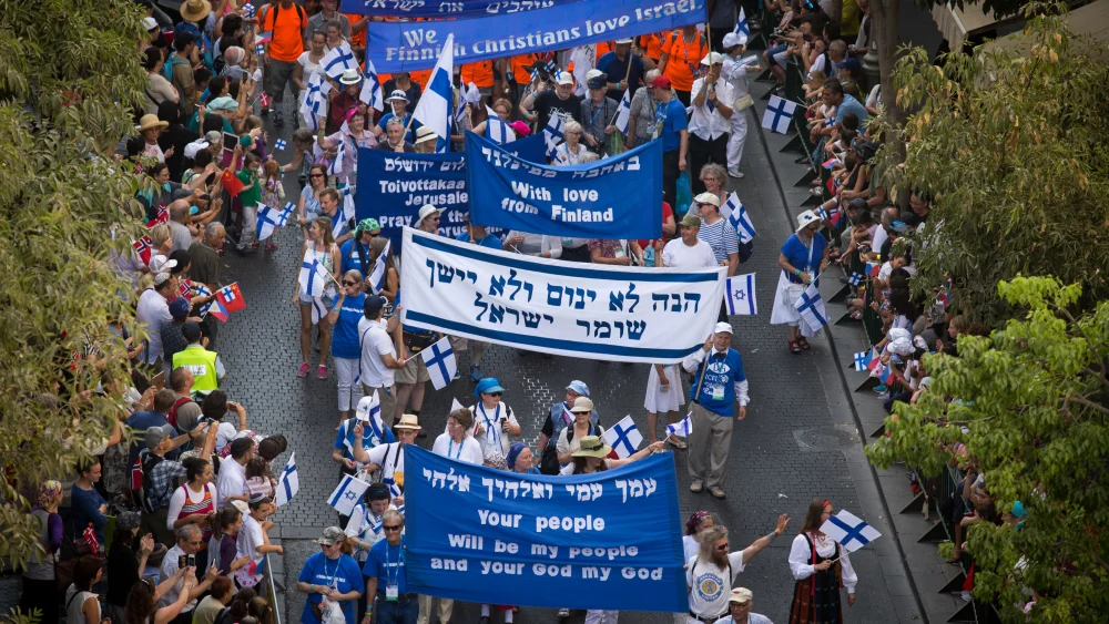 Thousands of Christian evangelists wave their national flag alongside the Israeli one as they march in a parade in the center of Jerusalem, marking the Jewish holiday of Sukkot, the Feast of the Tabernacles. Oct. 1, 2015. Photo by Nati Shohat/Flash90.