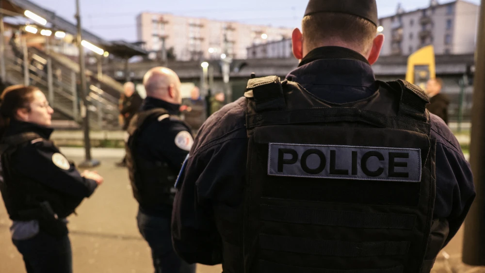 French police officers man a checkpoint at the Garges-Sarcelles train station ahead of New Year's Eve in Garges-lès-Gonesse, a suburb of Paris, on Dec. 31, 2025. Photo by Alain Jocard/Pool via AP.