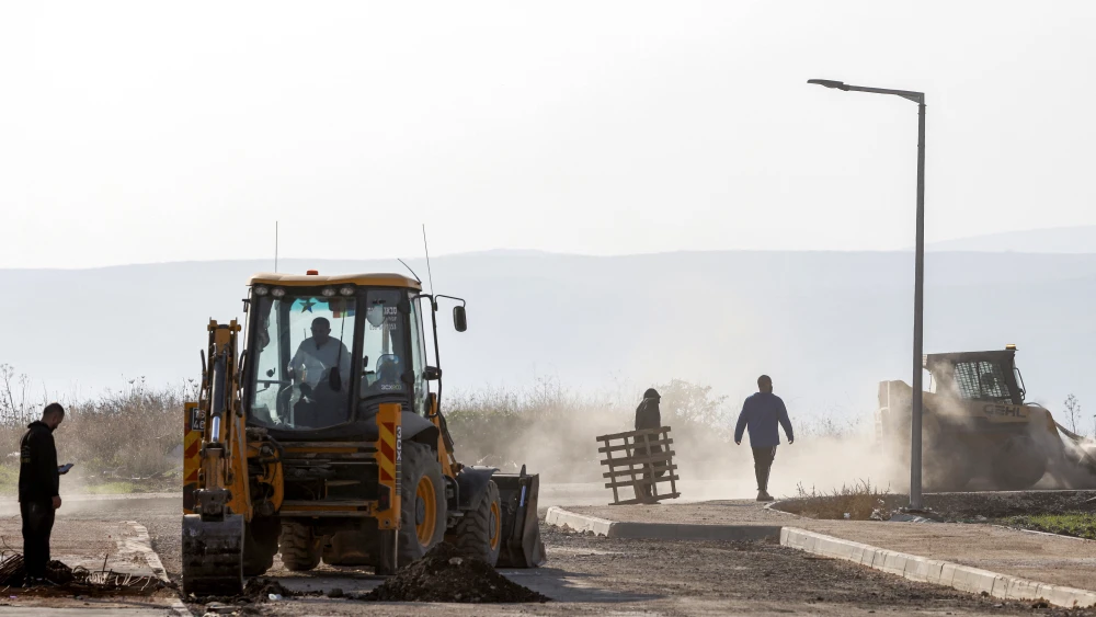 Bulldozers move during ongoing construction work at the settlement of Katzrin in the Israeli-annexed Golan Heights on Dec. 17, 2024. Photo by Jalaa Marey/AFP via Getty Images.