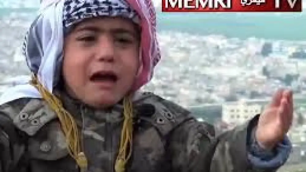 A young Jordanian boy, Amir Al-Khasawne, is seen here in an image taken from a recent YouTube video in which he volunteers go to Jerusalem to die as a "martyr." (MEMRI)