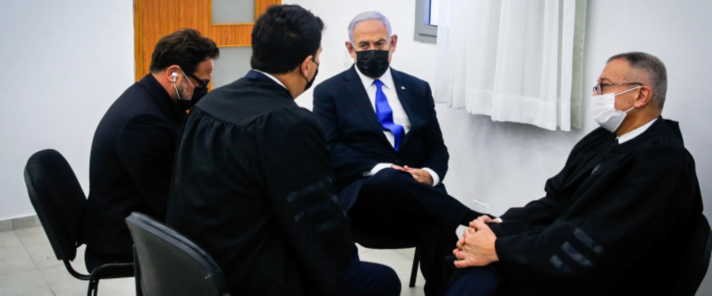 Israeli Prime Minister Benjamin confers with his legal staff at the District Court in Jerusalem on April 5, 2021. Photo by Oren Ben Hakoon/POOL.