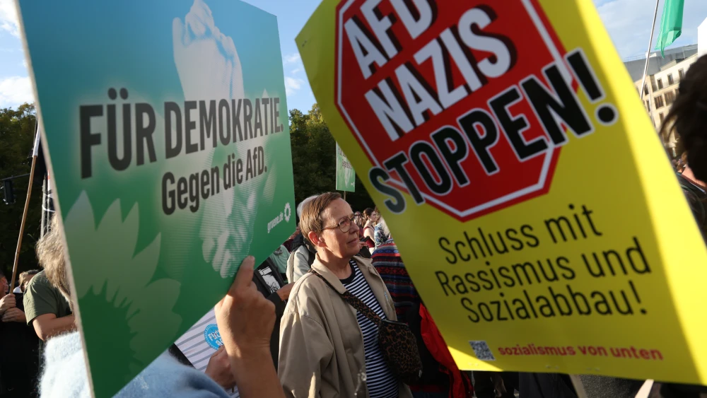 People gather in front of the Brandenburg Gate in Berlin to protest against the far-right Alternative for Germany (AfD) the day after the AfD won in Saxony-Anhalt state elections on Sept. 7, 2026. Photo by Sean Gallup/Getty Images.