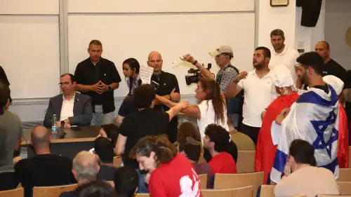 Anti-reform activists try to prevent Knesset member Simcha Rothman from speaking at Tel Aviv University, May 28, 2023. Photo by Gideon Markowitz/TPS.