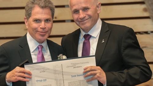 The Hebrew University of Jerusalem President Professor Asher Cohen (right) presents an Honorary Fellowship to Mr. Sam Sandler on June 12, 2023, during the 86th Board of Governors Meeting in Jerusalem. Credit: Bruno Charbit.