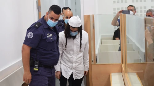 Amiram Ben-Uliel, the main suspect in the July 2015 Duma arson murders in which three members of the Dawabshe family were killed, arrives at the Lod District Court in central Israel to hear his verdict, May 18, 2020. Photo by Avshalom Sassoni/POOL.