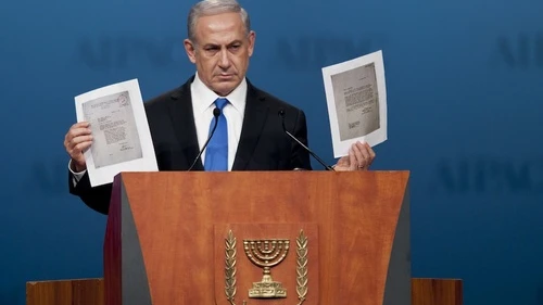 During his Monday night speech at the AIPAC policy conference, Prime Minister Benjamin Netanyahu holds up a copy of letters from 1944, in which the World Jewish Congress had implored the American government to bomb Auschwitz. Credit: EPA/PETE MAROVICH.