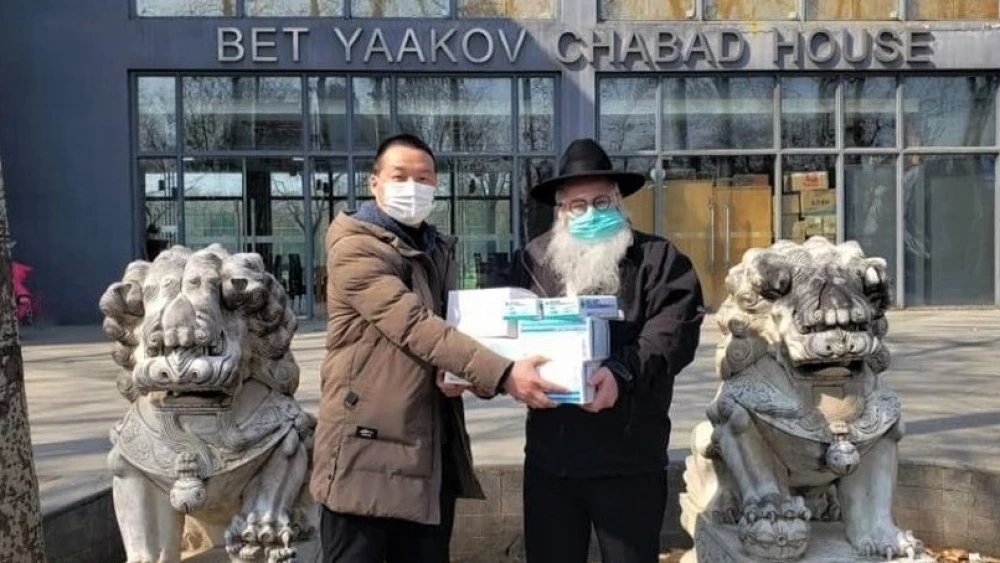 Rabbi Shimon Freundlich has stayed behind in Beijing, China, though his family evacuated to safety overseas. While much of the expatriate Jewish community has left China, Chabad-Lubavitch emissaries are still hard at work, helping local residents. Credit: Chabad.org/News.