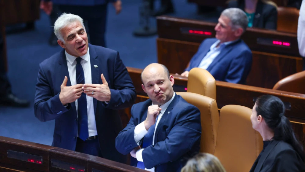 Then-Israeli Prime Minister Naftali Bennett (center), Foreign Minister Yair Lapid (left) and Defense Minister Benny Gantz attend a vote on the “settler law” bill at the Knesset, June 6, 2022. Photo by Yonatan Sindel/Flash90.