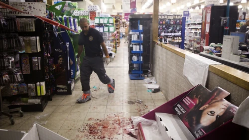 Israeli security and police forces are seen at the Rami Levy supermarket in the Mishor Adumim industrial zone, where a Palestinian man stabbed two people and was later shot by a security guard on Dec. 4, 2014. Police are treating the incident as a terror attack. Credit: Nati Shohat/Flash90.