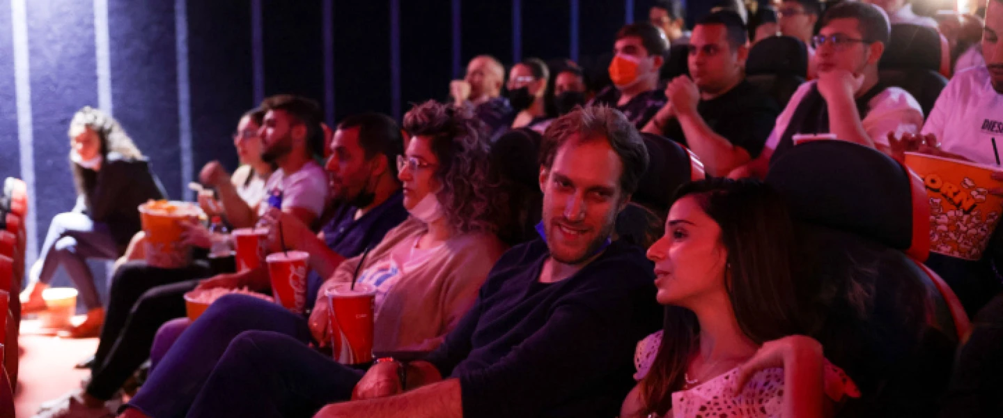 Israelis attend a movie at the Cinema City theater on the official reopening night after 14 months of closure during the coronavirus pandemic, on May 27, 2021 in Jerusalem. Photo by Olivier Fitoussi/Flash90.