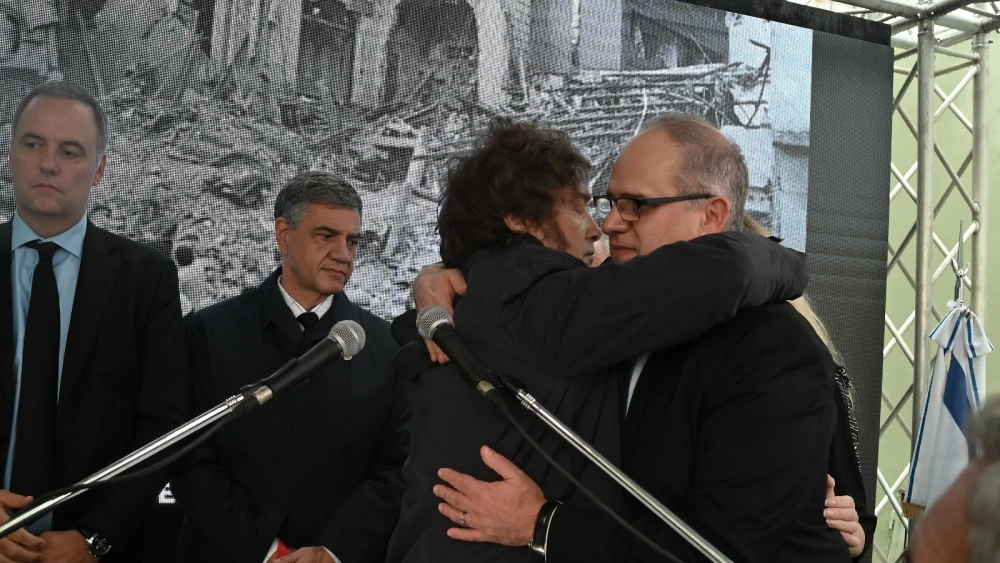 Argentinian President Javier Milei embraces Israeli Ambassador Eyal Sela at the annual memorial service commemorating the 1992 terror attack on the Israeli Embassy in Buenos Aires in March. Credit: Courtesy of Israeli Embassy in Argentina.