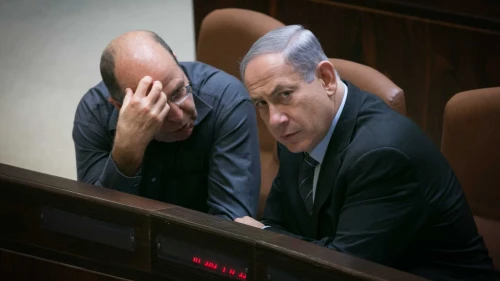 Israeli Prime Minister Benjamin Netanyahu speaks with Defense Minister Moshe Ya'alon in the plenary hall of the Knesset, the Israeli parliament in Jerusalem, May 11, 2015. Photo by Miriam Alster/Flash90.