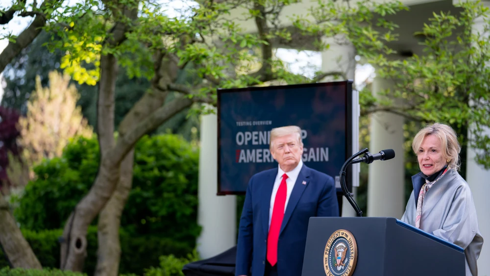 U.S. President Donald Trump looks on as White House coronavirus response coordinator Dr. Deborah Birx delivers remarks during a coronavirus update briefing on April 27, 2020, in the Rose Garden of the White House. Credit: Tia Dufour/The White House.