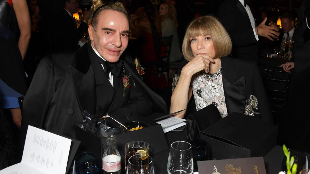 Fashion designer John Galliano and media executive Anna Wintour, then-editor-in-chief of Vogue magazine, attend a cocktail reception ahead of The Fashion Awards 2021 at Royal Albert Hall in London on Nov. 29, 2021. Photo by David M. Benett/Dave Benett/Getty Images.