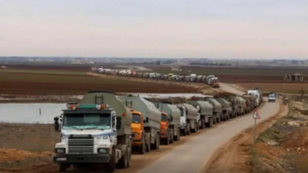 A convoy of more than 1,300 fuel tanker trucks bring Iranian fuel from a Syrian port to Lebanon Credit: Syria TV, Sept. 14, 2021.