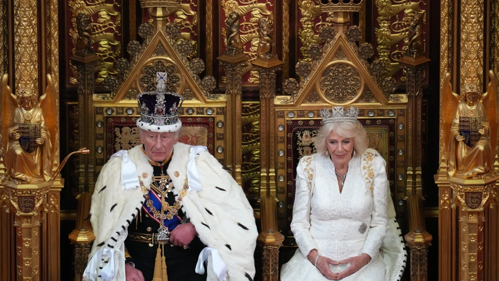 King Charles III sits beside Queen Camilla during the ceremonial opening of parliament, May 13, 2026. Photo by Kirsty Wigglesworth/WPA POOL/Getty Images.