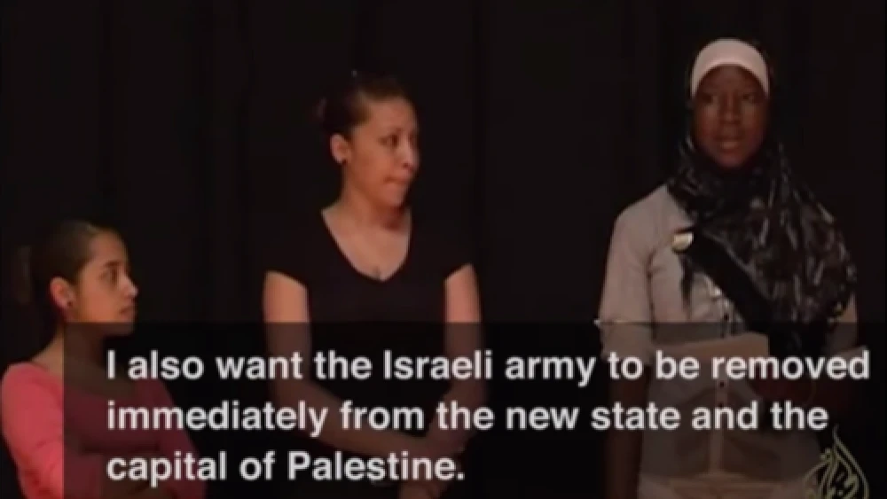 Click photo to download. Caption: During a role play exercise, a participant of Axis of Hope's "Whose Jerusalem?" workshop expresses the desire for the Israeli army "to be removed immediately from the new [Palestinian] state and the capital of Palestine." Credit: YouTube.