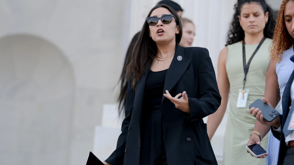 Rep. Alexandria Ocasio-Cortez (D-N.Y.) speaks to reporters on the House steps after a series of votes at the U.S. Capitol in Washington, D.C., on July 22, 2026. Photo by Anna Moneymaker/Getty Images.