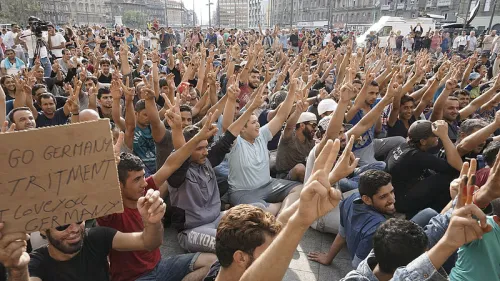 Young Syrian males refugees strike in front of the Budapest Keleti railway station in Budapest, Hungary, on Sept. 3, 2015. Credit: Mstyslav Chernov via Wikimedia Commons.