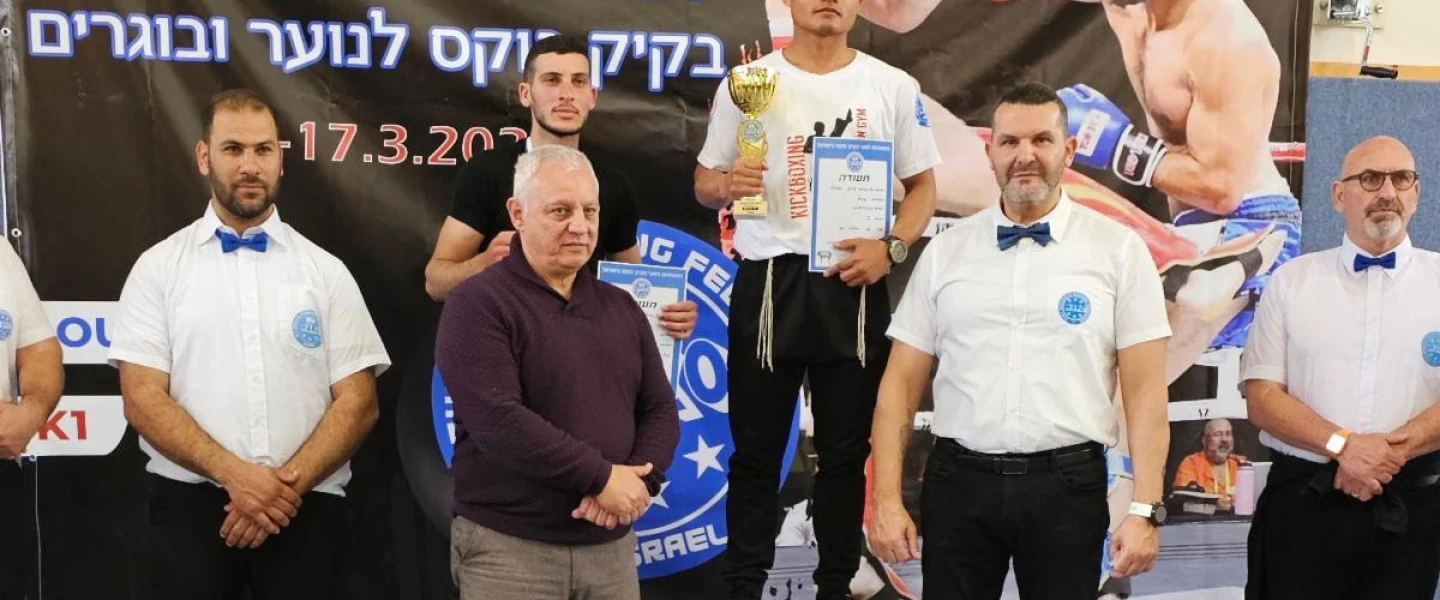 Obed Hrangchal stands in the champion's spot at the national tournament in Kfar Yasif, the Western Galilee, March 17, 2023. Courtesy.