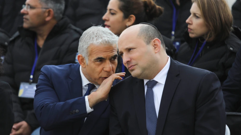 Then-Prime Minister Naftali Bennett and Foreign Minister Yair Lapid at Ben-Gurion Airport, March 21, 2022. Credit: Marc Israel Sellem/POOL.