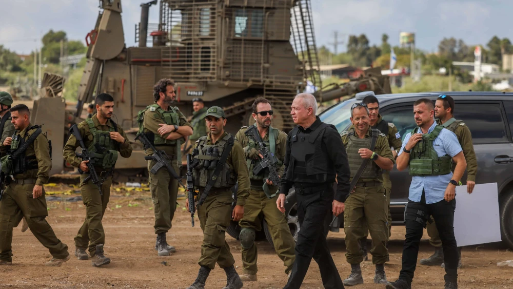 Israeli Defense Minister Yoav Gallant speaks with soldiers at a staging area near the Gaza Strip, Oct. 19, 2023. Photo by Chaim Goldberg/Flash90.