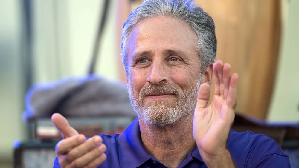 Jon Stewart applauding at the 2016 Department of Defense Warrior Games, June 21, 2016. Credit: DoD via Wikimedia Commons.