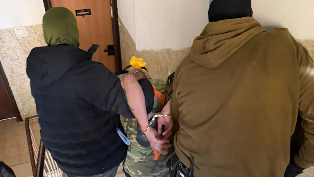 Israeli security forces detain Haifa resident Ami Gaidarov, 22, on suspicion of espionage on behalf of the Iranian regime, in March 2026. Credit: Israel Police Spokesperson's Unit.