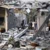 Israeli security forces inspect a house in Moshav Mishmeret, in central Israel, hit by a rocket fired from the Gaza Strip on March 25, 2019. Photo by Noam Revkin Fenton/Flash90.