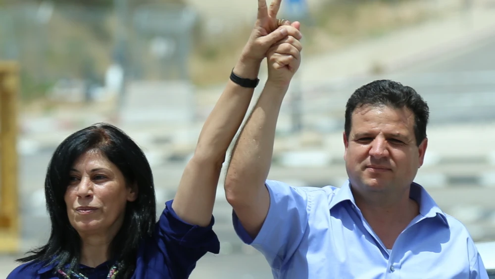 Khalida Jarrar (left), who was arrested by Israel's Shin Bet security service for her ties with the Popular Front for the Liberation of Palestinian, with Israeli-Arab Knesset member Ayman Odeh, head of the Joint Arab List. Credit: Wikimedia Commons.