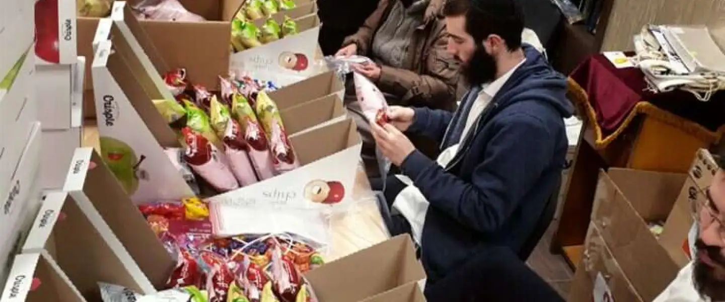 Chabad members in Kishinev, Moldova, prepare for Purim. Credit: Courtesy.