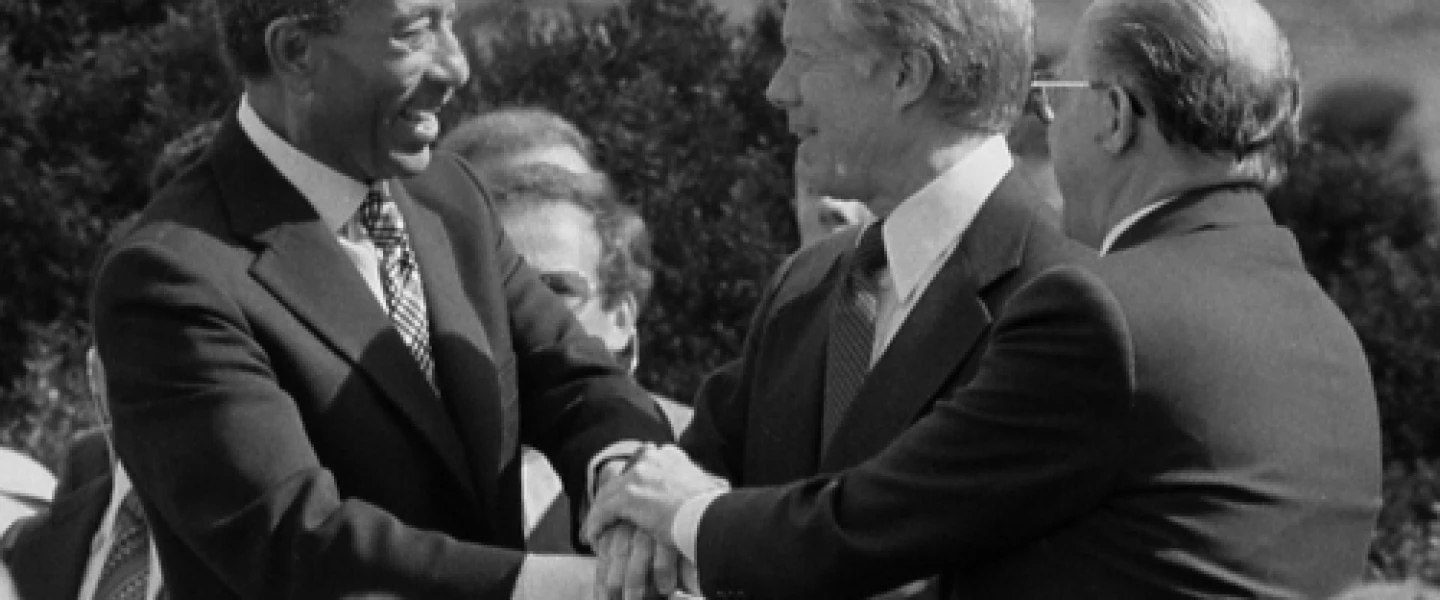 From left: Egyptian President Anwar Sadat, U.S. President Jimmy Carter and Israeli Prime Minister Menachem Begin at the White House for the signing of the 1979 Egypt-Israel peace treaty. A photo of the peace treaty's signing was added to the new edition of “The Geography of the Arab World and the History of Modern Egypt,” a ninth-grade Egyptian textbook. Credit: Warren K. Leffler via Wikimedia Commons.