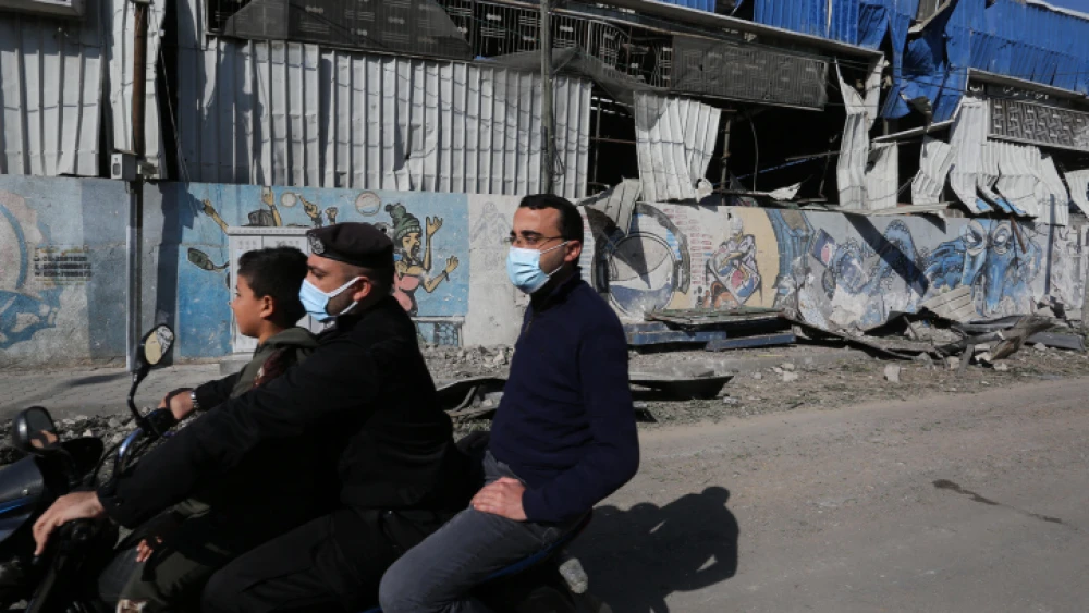 Palestinians inspect a site in Gaza hit by a retaliatory Israeli airstrike on Dec. 26, 2020. Photo by Ashraf Mohammed/Flash90.