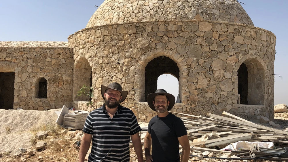 Ari Abramowitz and Jeremy Gimpel in front of their house of worship on Arugot Farms. Photo by Josh Hasten.