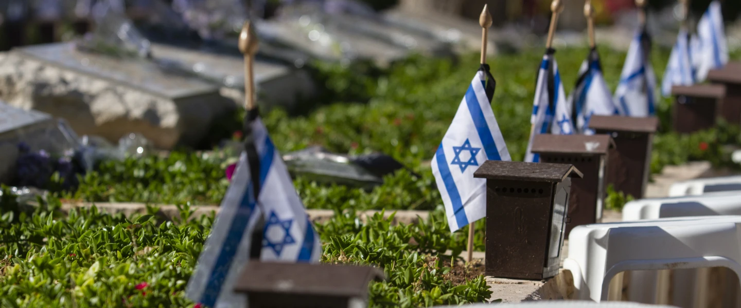 Israeli flags placed by each grave in the military cemetery of Netanya, ahead of the Israel's Memorial Day for fallen soldiers and victims of terror, on May 7, 2019. Photo by Flash90.