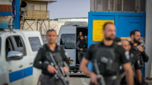 Guards escort Palestinian terrorists arriving at Ofer Prison, southwest of Ramallah, being released as part of a deal between Israel and Hamas, Nov. 25, 2023. Photo by Jamal Awad/Flash90.
