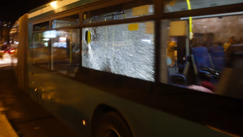 File photo: View of a broken window after Palestinians youths threw stones at an Israeli bus on Oct. 14, 2013. Photo by Sliman Khader/FLASH90.