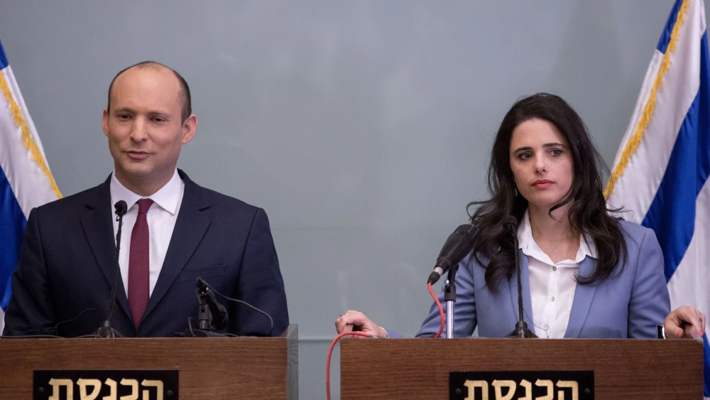 Israeli Education Minister Nafatli Bennett and Justice Minister Ayelet Shaked deliver a statement during a press conference in the Israeli parliament on Nov. 19, 2018. Credit: Miriam Alster/Flash90.