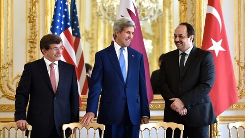 On July 26, 2014, (from left to right) Turkish Foreign Minister Ahmet Davutoğlu, U.S. Secretary of State John Kerry, and Qatari Foreign Minister Khalid bin Mohammad Al Attiyah hold a trilateral meeting in Paris focused on reaching a cease-fire deal for the Gaza conflict. JNS.org columnist Ben Cohen asks: Should we continue ignoring Qatari and Turkish backing of Hamas for the sake of a successful campaign against Islamic State? Credit: State Department.