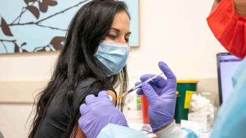 A worker from the education field receives a COIVID-19 vaccine injection at a Maccabi vaccination center in Modi'in on Jan. 12, 2021. Photo by Yossi Aloni/Flash90.