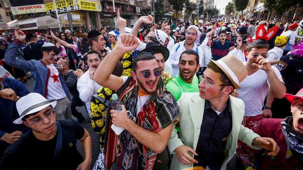 A crowd of celebrants during Purim in the city of Bnei Brak on March 7, 2023. Photo by Erik Marmor/Flash90.