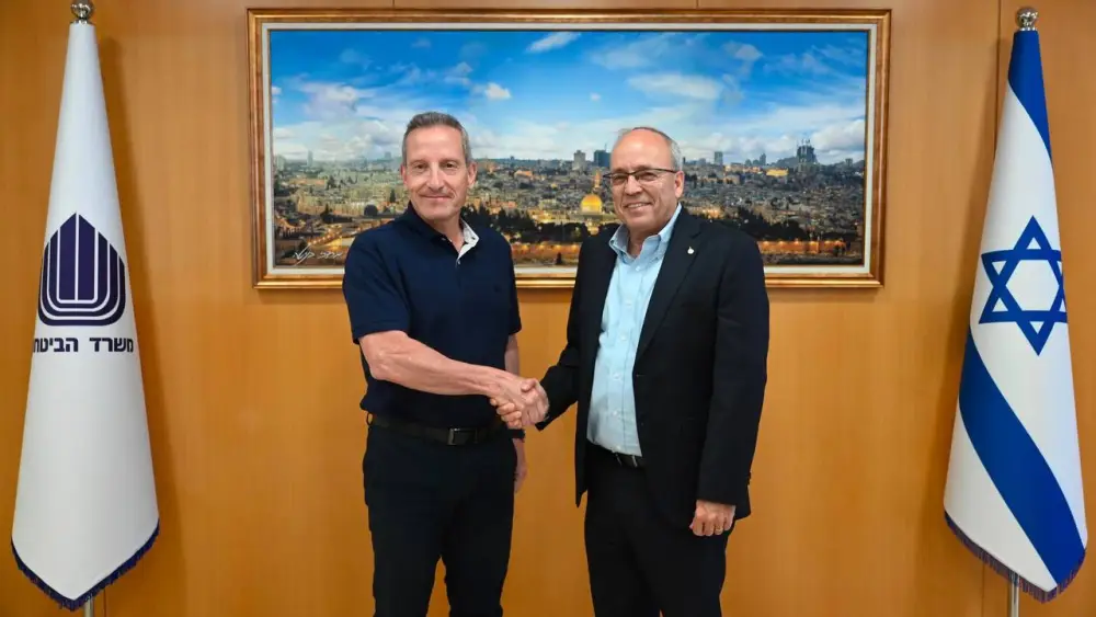 In this undated handout photo published by the Defense Ministry on July 22, 2026, Israel Ministry of Defense Director General Maj. Gen. (res.) Amir Baram, left, and Manufacturers Association President Avraham Novogrodsky shake hands after a working meeting. The meeting focused on formulating a strategic plan to expand domestic weapons production. Credit: Israel Ministry of Defense.